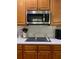 Built-in microwave above a smooth cooktop at 2631 Gladstone Ter, Woodstock, GA 30189