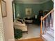 Cozy living room featuring a comfy sofa and soft green walls at 2631 Gladstone Ter, Woodstock, GA 30189