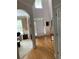 Bright entry hall with hardwood floors, high ceilings, and views into the living room at 2631 Gladstone Ter, Woodstock, GA 30189