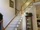 Elegant staircase with hardwood steps and white railings at 2631 Gladstone Ter, Woodstock, GA 30189