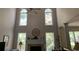 Bright Gathering room with a fireplace and tall windows at 2631 Gladstone Ter, Woodstock, GA 30189