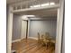 Finished basement room with wood floors and dining set at 2631 Gladstone Ter, Woodstock, GA 30189