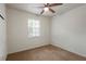 Bright bedroom with carpeted floors and ceiling fan at 6584 Sleepy Hollow Ln, Morrow, GA 30260