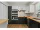 Modern kitchen featuring updated appliances and wood countertops at 6584 Sleepy Hollow Ln, Morrow, GA 30260