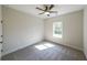 Bright bedroom with carpeted floor and window at 735 Asbury Road, Temple, GA 30179