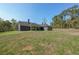 A spacious house with a large backyard and a covered patio at 735 Asbury Road, Temple, GA 30179