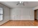 Bright bedroom with hardwood floors and double door closet at 4797 Cedar Wood Sw Dr, Lilburn, GA 30047