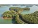 Lakefront property with lush green vegetation and a private dock at 615 Skytop Dr, Cumming, GA 30040