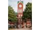 Cumming City Hall, a brick building with a clock tower and green roof at 615 Skytop Dr, Cumming, GA 30040