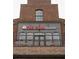 The Club at Tin Cup Grill, brick building with balcony at 615 Skytop Dr, Cumming, GA 30040