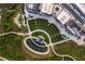 Aerial view of community with amphitheater, pond, and walking paths at 615 Skytop Dr, Cumming, GA 30040