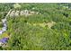 Aerial view of house nestled in a wooded neighborhood at 725 Holland Rd, Powder Springs, GA 30127