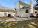 Rear view of house showing walkway, deck and AC unit at 9997 Point View Dr, Jonesboro, GA 30238