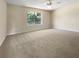 Spacious bedroom with neutral walls and plush carpeting at 9997 Point View Dr, Jonesboro, GA 30238