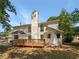Two story house with wooden deck and landscaped yard at 9997 Point View Dr, Jonesboro, GA 30238