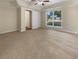 Spacious bedroom with neutral carpeting and large window at 9997 Point View Dr, Jonesboro, GA 30238