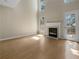 Living room with hardwood floors, fireplace, and high ceilings at 9997 Point View Dr, Jonesboro, GA 30238