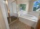 Bathroom with a garden tub and a separate shower stall at 9997 Point View Dr, Jonesboro, GA 30238