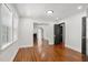 Bright dining room with hardwood floors and views into the living room at 1834 Avon Sw Ave, Atlanta, GA 30311