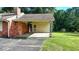 Side view of a ranch house with a covered patio area at 5690 Abbotts Bridge Rd, Johns Creek, GA 30097