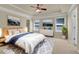 Main bedroom with tray ceiling, carpet, and ensuite bathroom at 3438 Old Towne Ln, Cumming, GA 30040