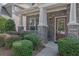 Front entrance with stone accents and a red door at 3438 Old Towne Ln, Cumming, GA 30040