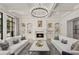 Living room with fireplace, built-in shelving and hardwood floors at 570 Stonemoor Cir, Roswell, GA 30075