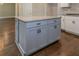 Large kitchen island with granite countertop and light gray cabinets at 200 Etris Grove Ct, Roswell, GA 30075