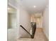 Upstairs hallway with carpet and access to bedrooms at 200 Etris Grove Ct, Roswell, GA 30075