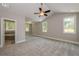 Large main bedroom with high ceilings, carpet, and ensuite bathroom at 200 Etris Grove Ct, Roswell, GA 30075