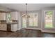 Bright breakfast area with hardwood floors and view of backyard at 200 Etris Grove Ct, Roswell, GA 30075