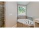 Bathroom with corner soaking tub and walk-in shower at 200 Etris Grove Ct, Roswell, GA 30075