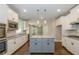 Modern kitchen with white cabinets, granite countertops, and stainless steel appliances at 200 Etris Grove Ct, Roswell, GA 30075