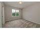 Spacious bedroom with carpet and large window at 200 Etris Grove Ct, Roswell, GA 30075