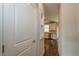 Clean hallway with built-in shelving and view into kitchen at 200 Etris Grove Ct, Roswell, GA 30075