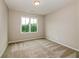 Bright bedroom with carpet flooring and a large window at 200 Etris Grove Ct, Roswell, GA 30075