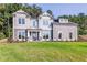 Two story gray house with white accents and green lawn at 200 Etris Grove Ct, Roswell, GA 30075