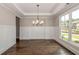 Formal dining room with hardwood floors and wainscoting at 200 Etris Grove Ct, Roswell, GA 30075