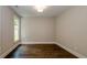 Neutral-toned home office with hardwood floors and large window at 200 Etris Grove Ct, Roswell, GA 30075