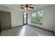 Bright bedroom with carpeting, door to balcony, and large windows at 390 17Th Nw St # 4037, Atlanta, GA 30363