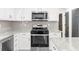 Modern kitchen featuring stainless steel appliances and white cabinets at 1161 Appian Way, Lawrenceville, GA 30046