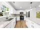 Spacious kitchen with stainless steel appliances and white cabinetry at 1161 Appian Way, Lawrenceville, GA 30046