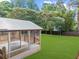 Screened porch with a view of the backyard, perfect for enjoying the outdoors at 1161 Appian Way, Lawrenceville, GA 30046