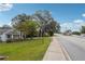 Residential street with houses and trees at 5665 Austell Powder Springs Rd, Austell, GA 30106