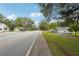 Residential street with houses and trees at 5665 Austell Powder Springs Rd, Austell, GA 30106