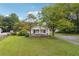 White house with front porch and lawn at 5665 Austell Powder Springs Rd, Austell, GA 30106