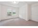 Well-lit bedroom with carpet and ample closet space at 5665 Austell Powder Springs Rd, Austell, GA 30106