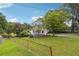 White house with front porch and fenced yard at 5665 Austell Powder Springs Rd, Austell, GA 30106