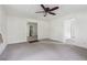 Spacious living room with carpeted floor and ceiling fan at 5665 Austell Powder Springs Rd, Austell, GA 30106