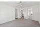 Carpeted bedroom with doors to other rooms at 5665 Austell Powder Springs Rd, Austell, GA 30106